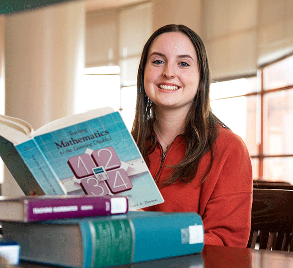 Student teacher Halle Aparicio leads a math lesson with confidence and clarity, engaging young learners through interactive instruction and a warm classroom presence.